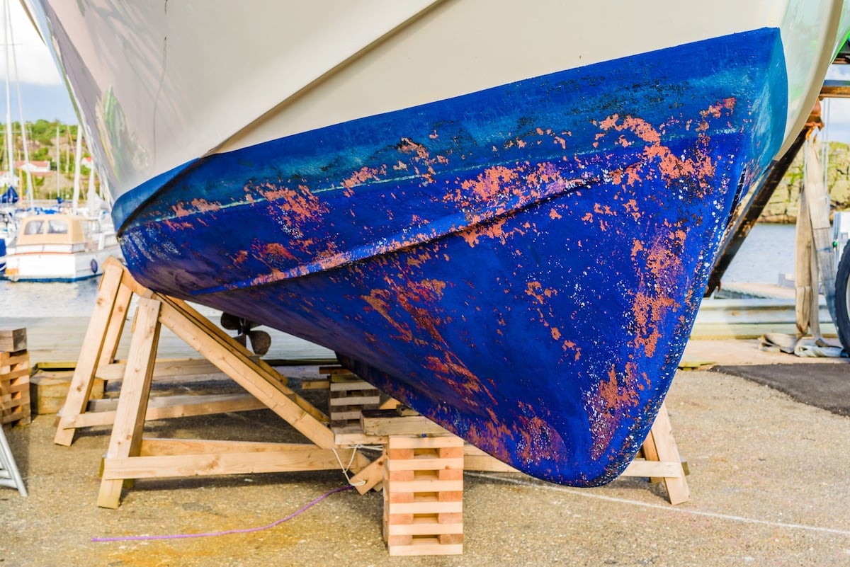 Close up of a blue boat keel seen from the front or fore.