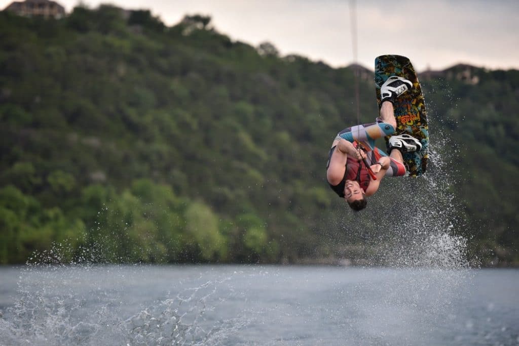 Guy flipping on wakeboard