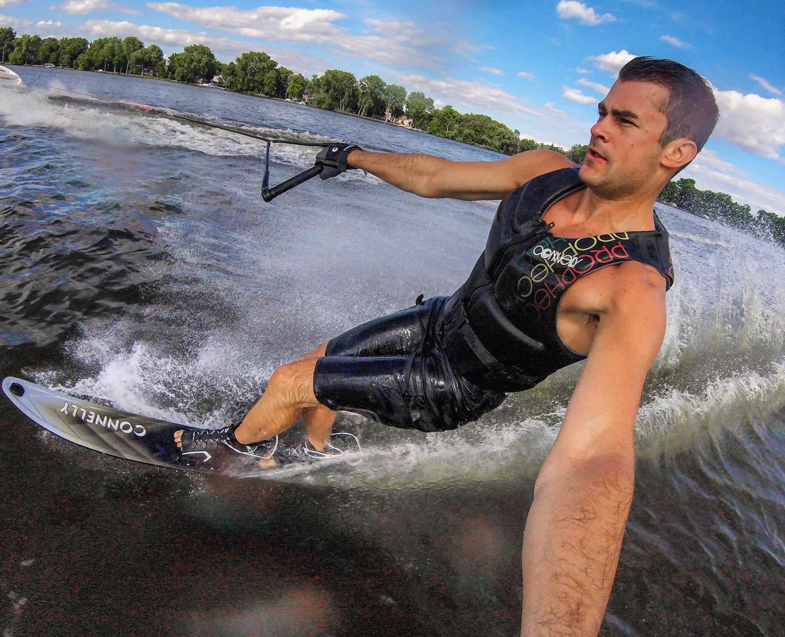 man holding tether while water skiing