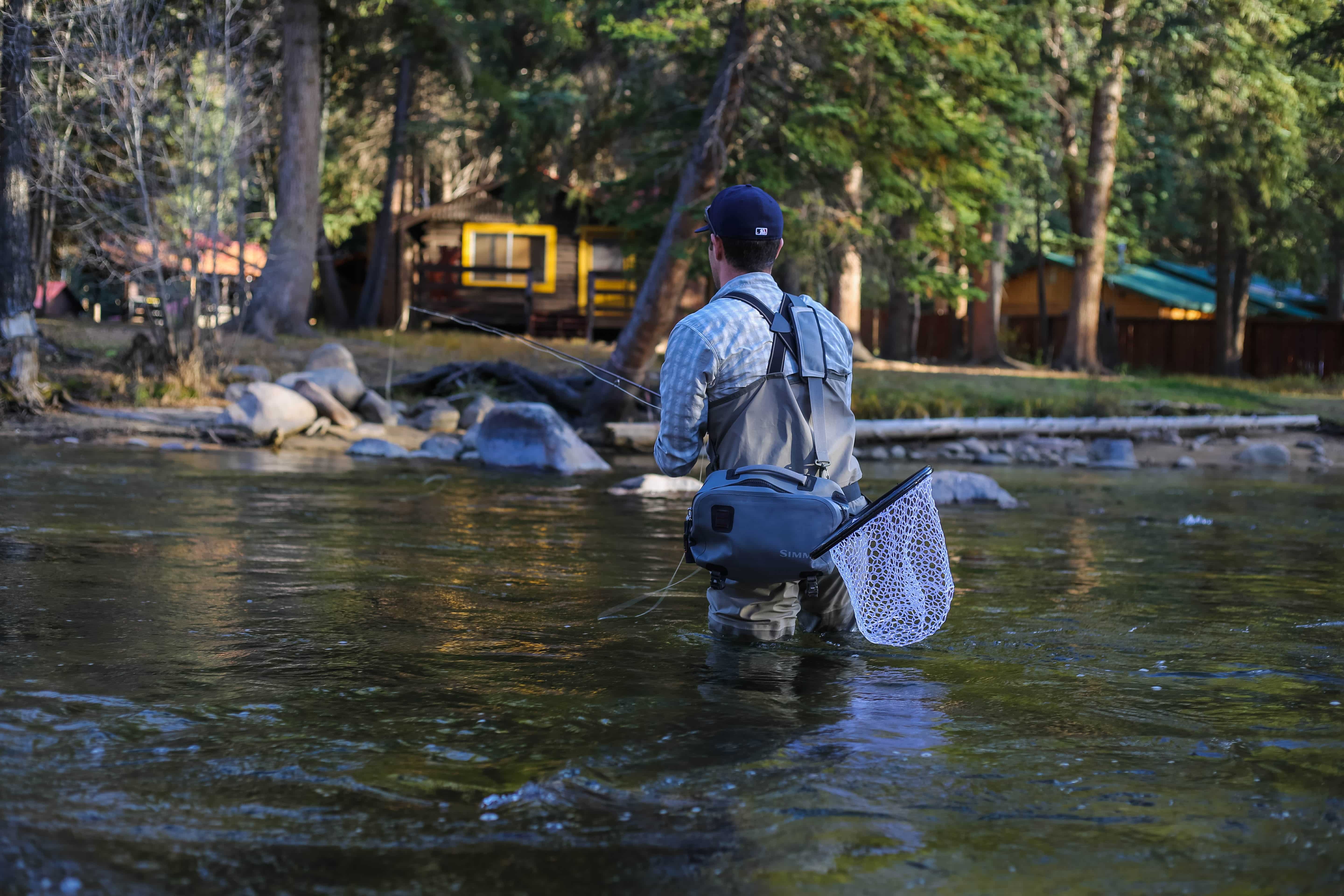 Image of a fly angler with a net 