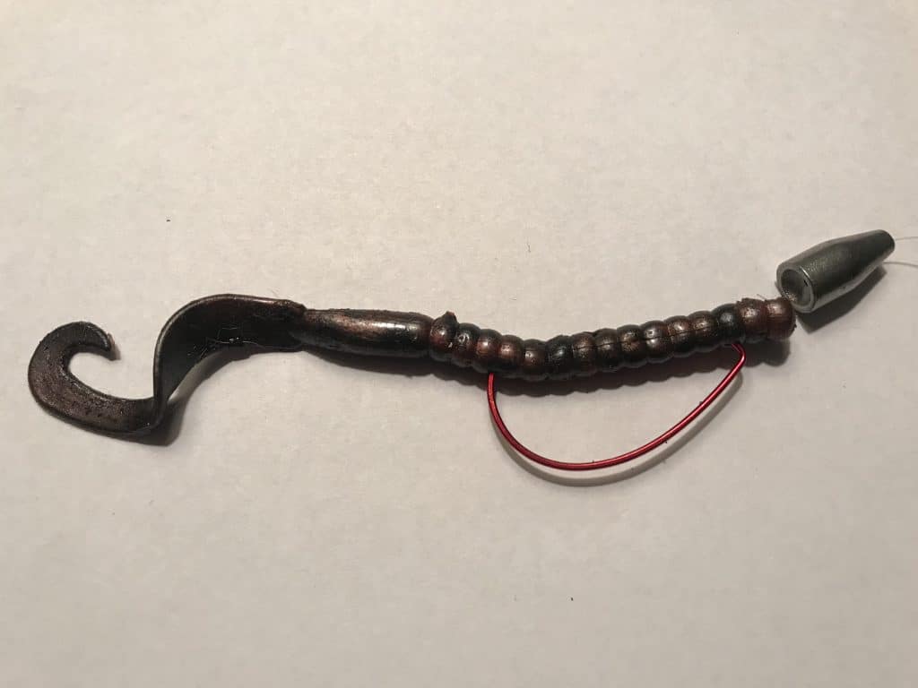 Black and red Texas rig fishing worm