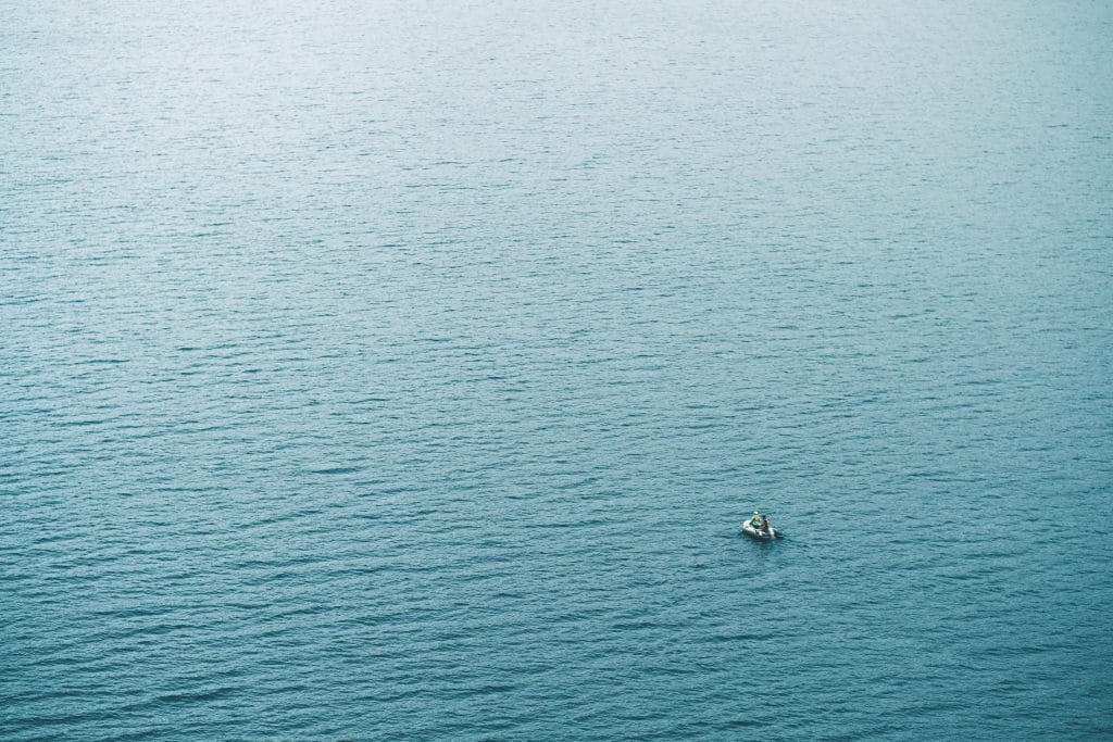 couple on small boat in open water