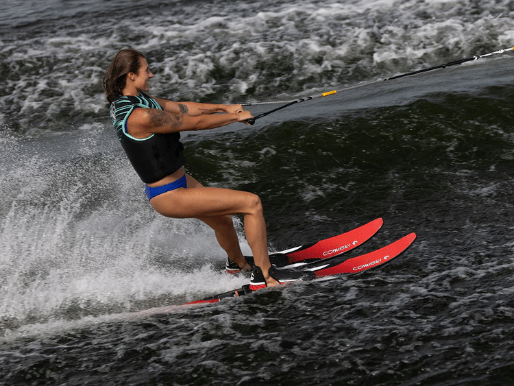 Women water skiing with combo skis