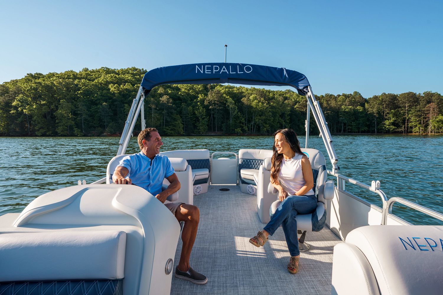 Two captain's chairs in pontoon boat 